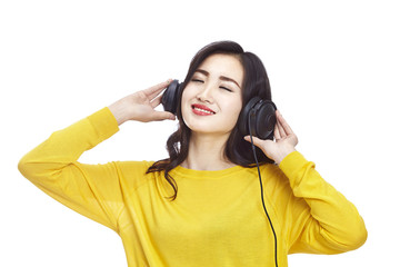 asian woman enjoying music eyes closed isolated on white background.