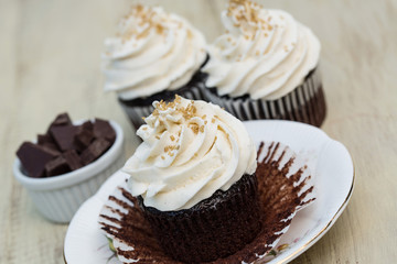 Close Up Chocolate Cupcakes With White Vanilla Icing