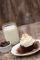 Chocolate Cupcake With Wrapper Peeled and Milk