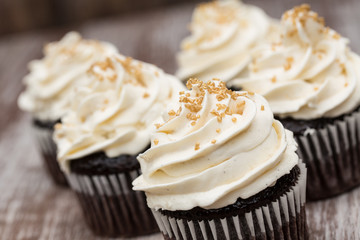Close Up Chocolate Cupcakes With Vanilla Frosting - obrazy, fototapety, plakaty