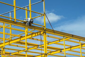 Worker is welding steel on construction site.