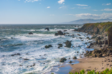 Fototapeta na wymiar Incredible landscape of the coast. Beautiful blue sea. The waves rolled ashore and breaking on the rocks. Sonoma Coast State Park, California, USA