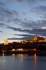 Czech Republic, Prague, Night view on Hradcany castle.Beautifully lit castle and Vltava river in the foreground.