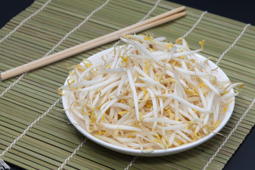 mung bean sprout on plate and black background