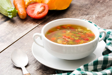 Vegetable soup in bowl on wooden table
