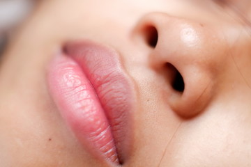 Obraz premium Young Asian woman closeup face sleeping during the day