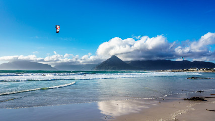 Kitesurfing at the beach community of Het Kommitjie on the Atlantic Ocean side of the Cape Peninsula in South Africa