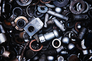 Abstract background of metal nuts, metal products, bolts, studs, washers.