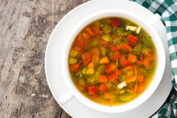 Vegetable soup in bowl on wooden table
