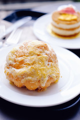 Pinoy Ensaymada bread, with sugar and cheese on top