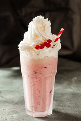 Berry milkshake decorated with red currant