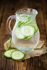 Fresh made Cucumber Water on a rustic background