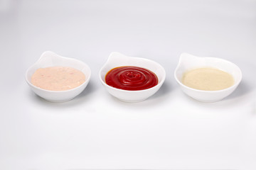 Close up photo of three different dipping dressing sauces