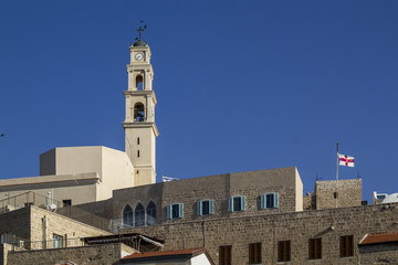 Obraz premium Old Jaffa - Bell tower of St. Peter catholic church and abbey in Old Jaffa as seen from the Sea.Israel