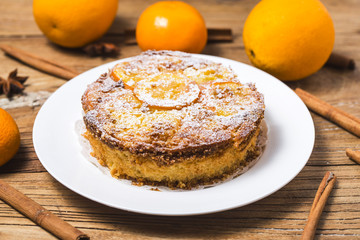 Orange cake on the wooden background