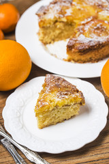 Orange cake on the wooden background