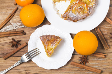 Orange cake on the wooden background