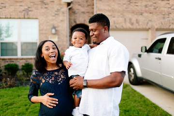 Family in front of house