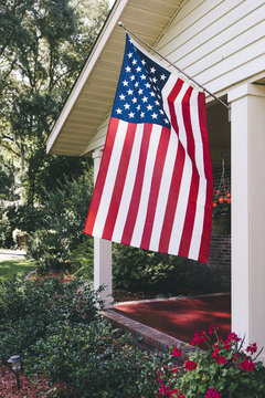 American flag hanging on front porch