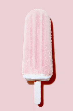 pastel pink popsicle ice cream on pink background