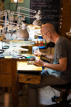 Jeweler making a necklace on his wokshop