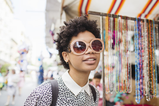 Beautiful afro woman wearing a pair of sunglasses