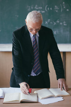 Portrait of a mature professor in a classroom