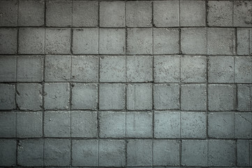 Grey concrete background with square bricks