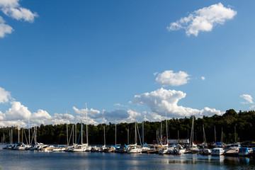 Fototapeta na wymiar Yachts and fishing boats in the lake, Sweden