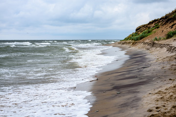 View of a stormy beach in the morning.
