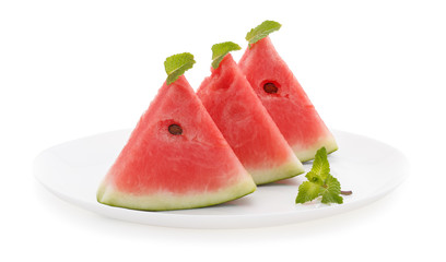 Slices of watermelon on plate isolated on white background.