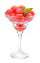 Balls of watermelon in a glass Cremant. Isolated on white.