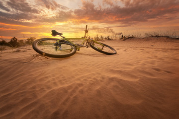 bicycle in the desert / yellow hot sunset late summer