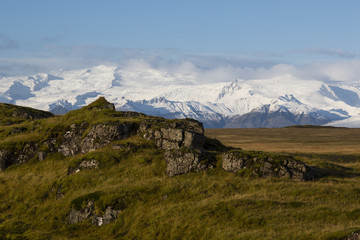Landscape in island with glacier-covered mountains