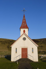 Fototapeta na wymiar Picturesque church with a red roof in island
