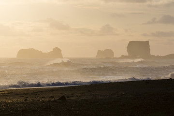 Cape Dirholaey in southern Iceland during sunset on a foggy day