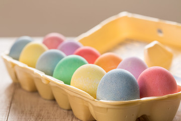 close up of Colored Easter Eggs in Carton