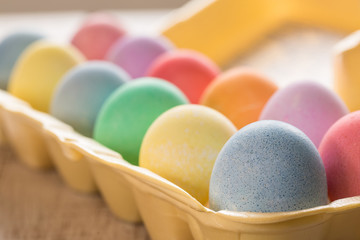 close up of Colored Easter Eggs in Carton