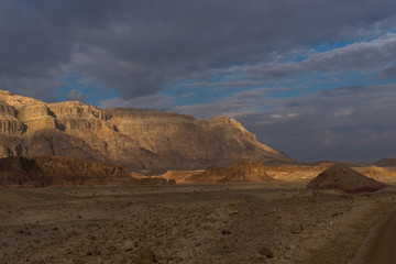 Fototapeta na wymiar Multi-colored sand mountains in Middle East