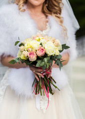 Naklejka premium bridal bouquet in hands of the bride, bridal accessories, wedding European, American Wedding