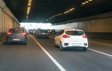 cars leaving tunnel in downtown