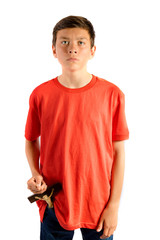 Young teenage boy isolated against white removing a cruxifix from his pocket