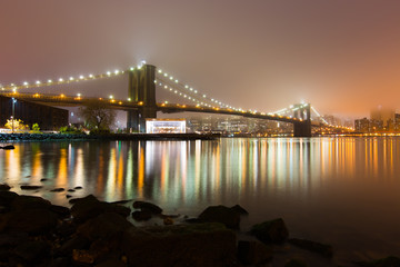 Foggy Brooklyn Bridge and Lower Manhattan.