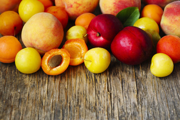 Fresh summer fruits on wooden background