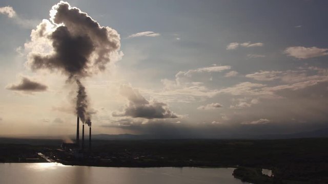 Factory smokestacks, steaming and smoking, breathtaking black and white aerial view. 4л