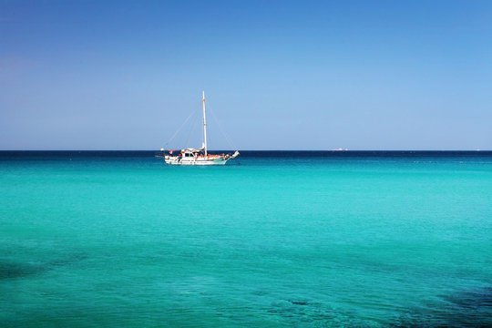 sailboat in the blue water