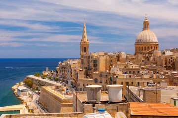View from above of roofs and church of Our Lady of Mount Carmel and St. Paul's Anglican Pro-Cathedral, Valletta, Capital city of Malta - obrazy, fototapety, plakaty