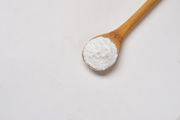 Baking soda on a wooden spoon