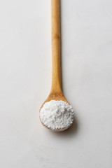 Baking soda on a wooden spoon