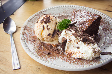 ice cream Vanilla chocolate pie whippin creamy tasty dessert on wood table in cafe ready to eat in restaurant.